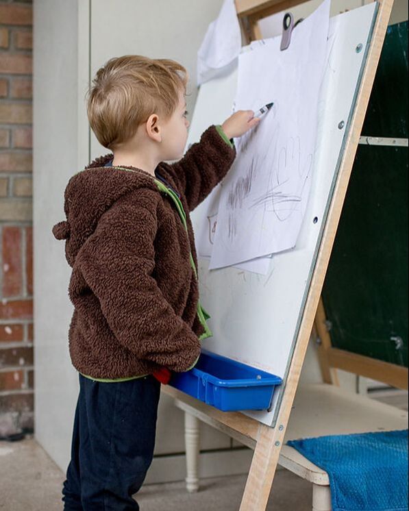 boy draws at Leelanau Montessori 
