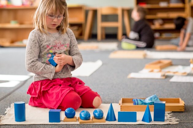 young student at Leelanau Montessori working with shapes